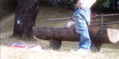 A young gay having a good wank in public